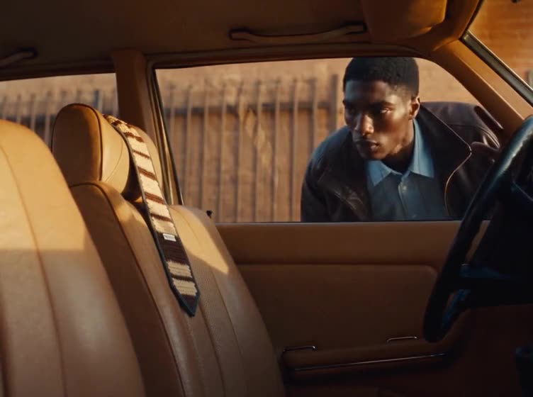Carry it. Tie it. — film still